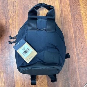 North face never stop mini backpack